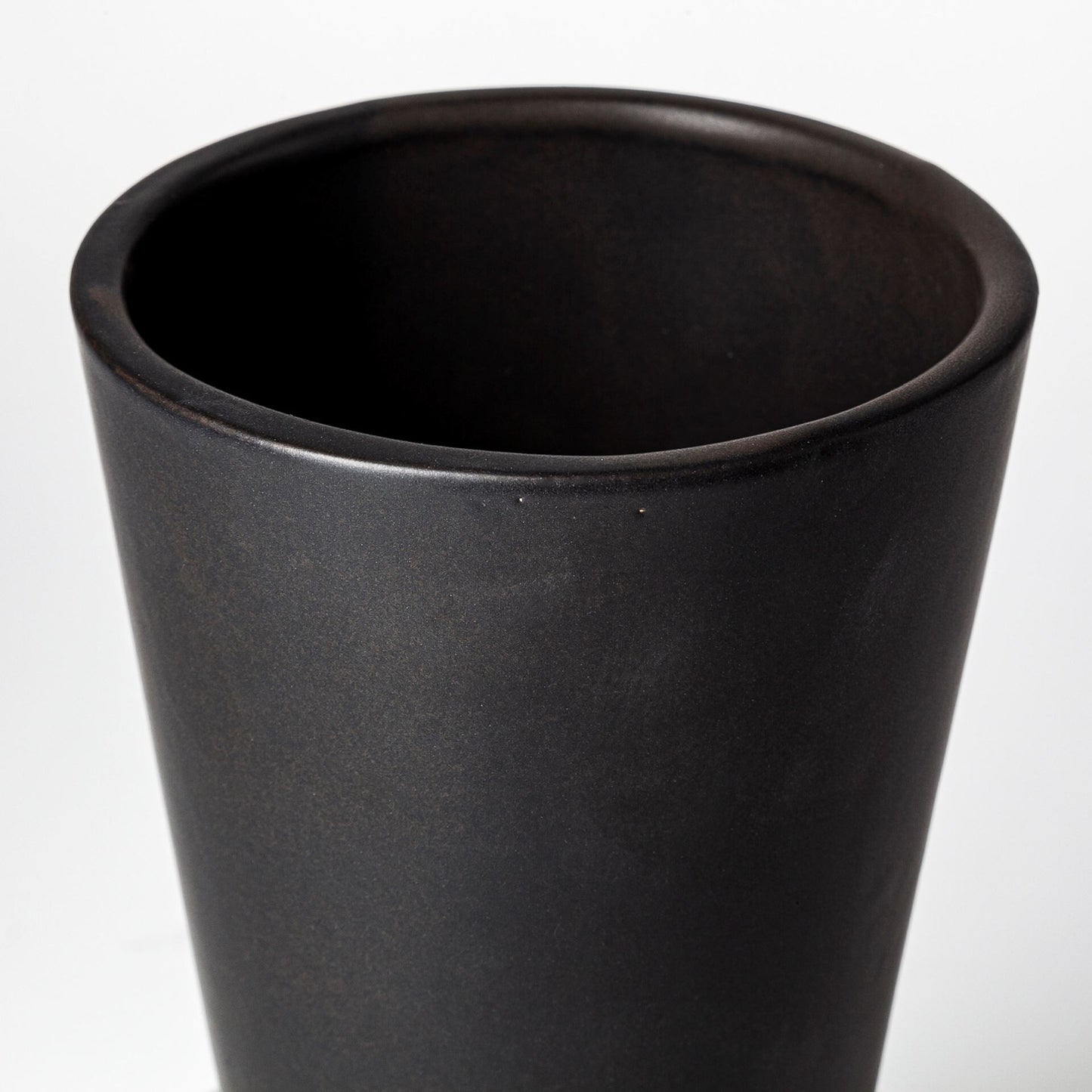 Contemporary black ceramic vase with matte surface, 9 inch modern home decor accent