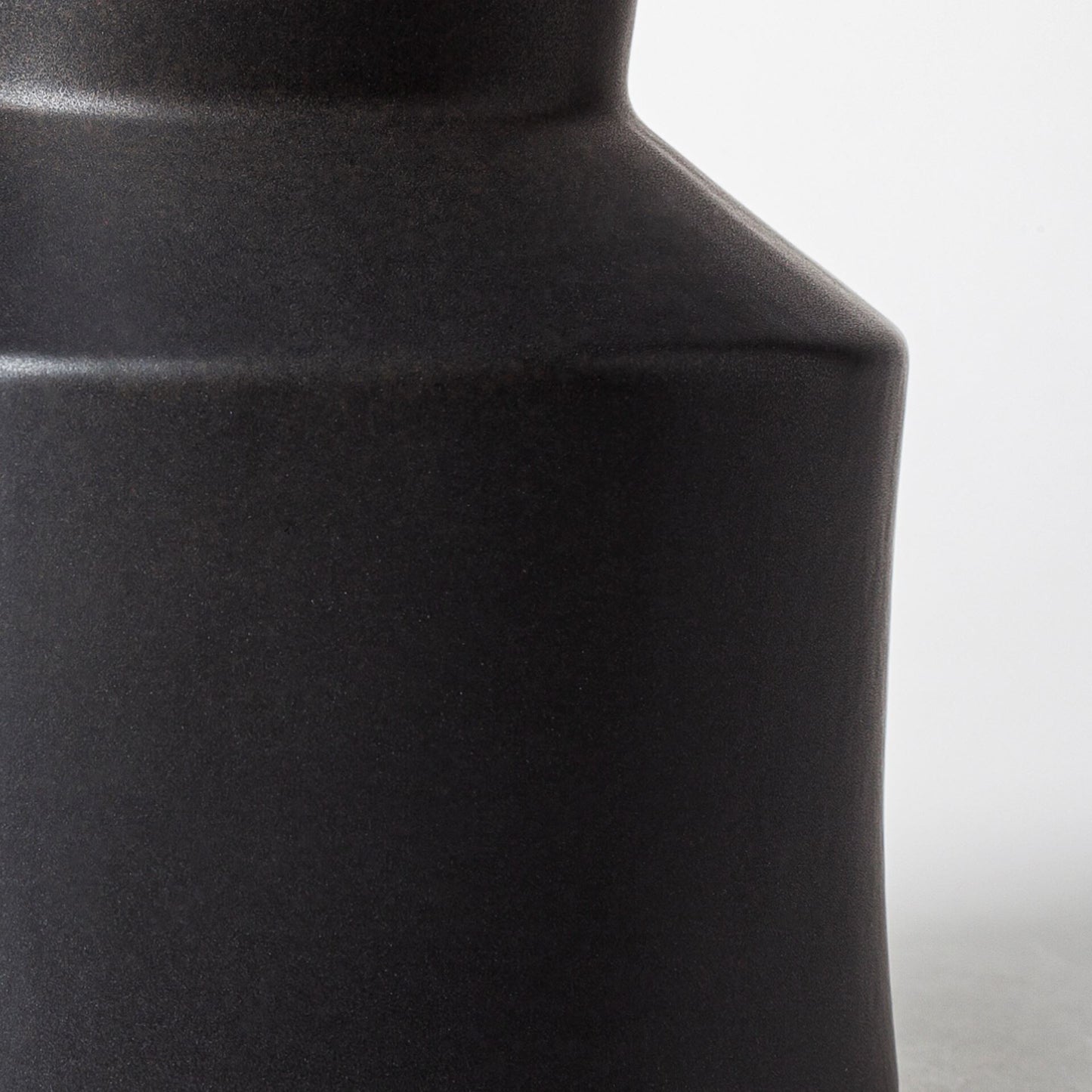 9 inch matte black ceramic vase showing deco style design, sophisticated modern decor
