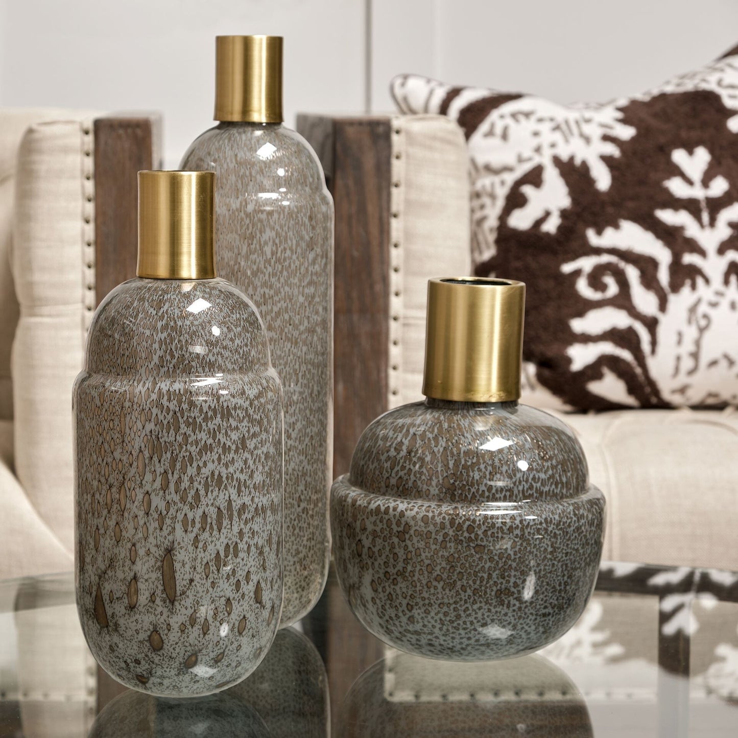 Elegant crystal glass vase close-up displaying speckled brown finish and gold accent at narrow mouth