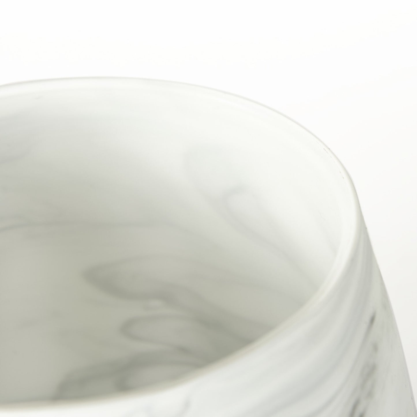 Detail shot of marble pattern glass vase showing sophisticated gray and cream color blend with translucent quality, versatile decorative accent piece