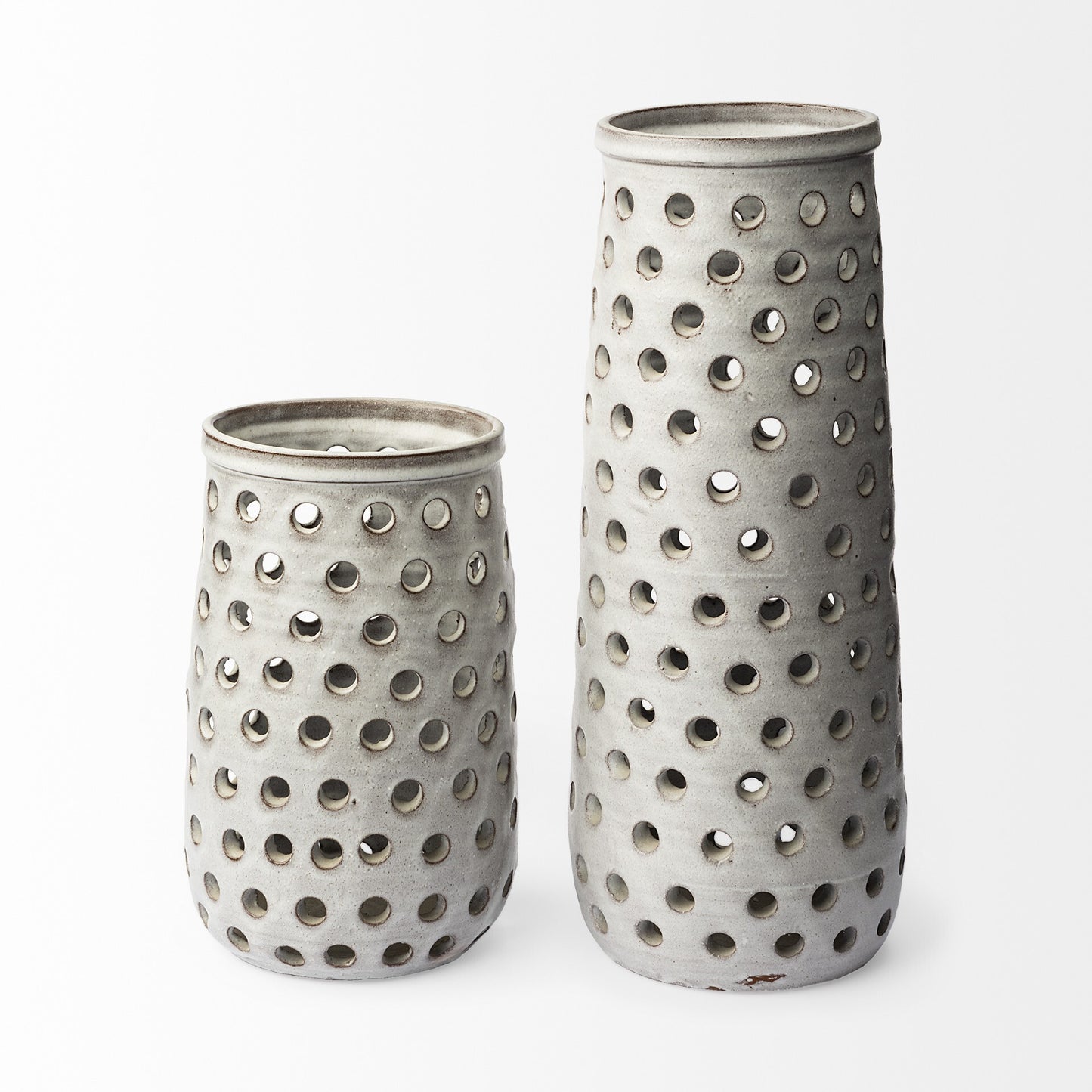 Side view of 12-inch organic glaze ceramic vase displaying beautiful translucent white finish and small circular hollow details throughout the body