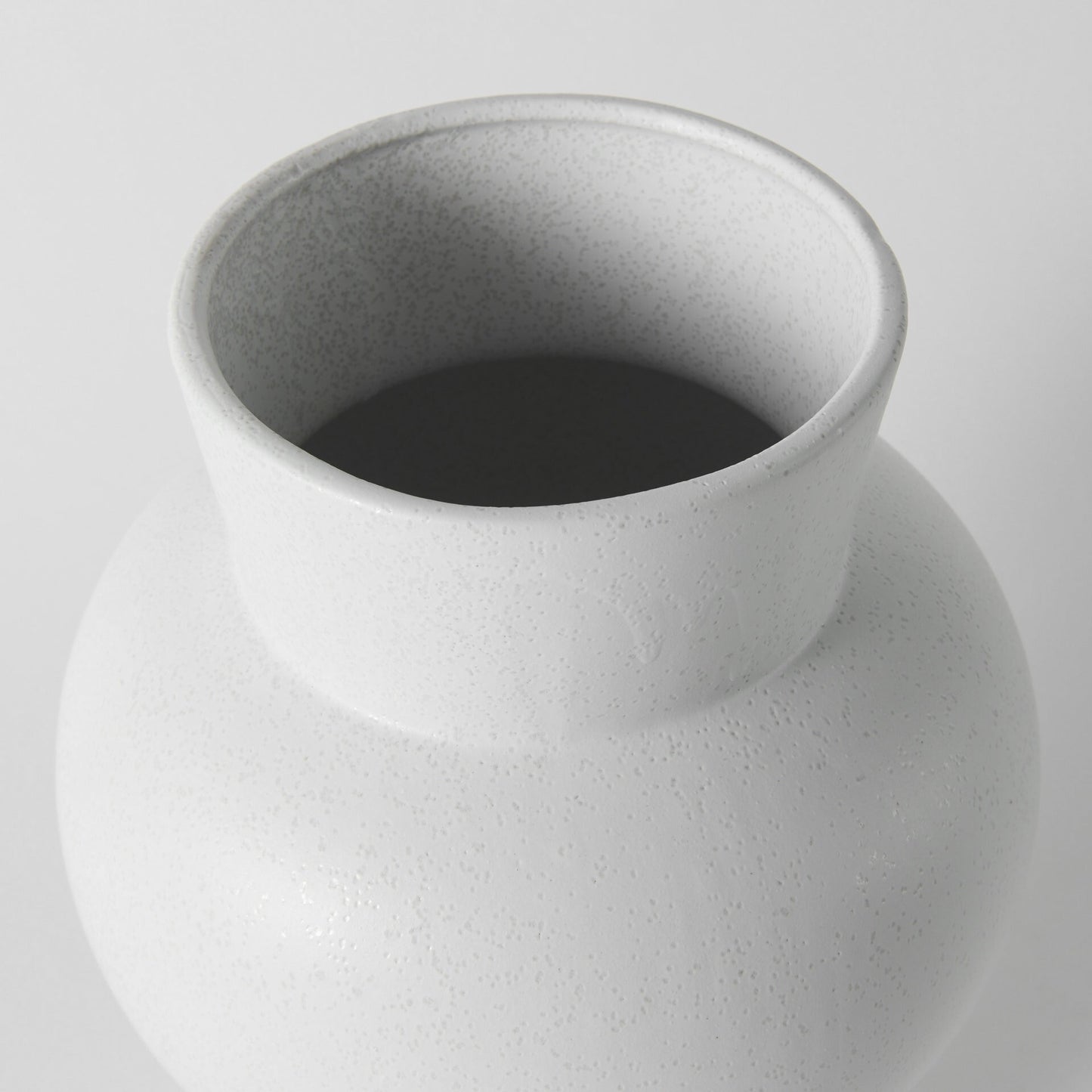 Top view of contemporary white vase revealing conical opening and geometric design, perfect for fresh flowers or dried botanical arrangements