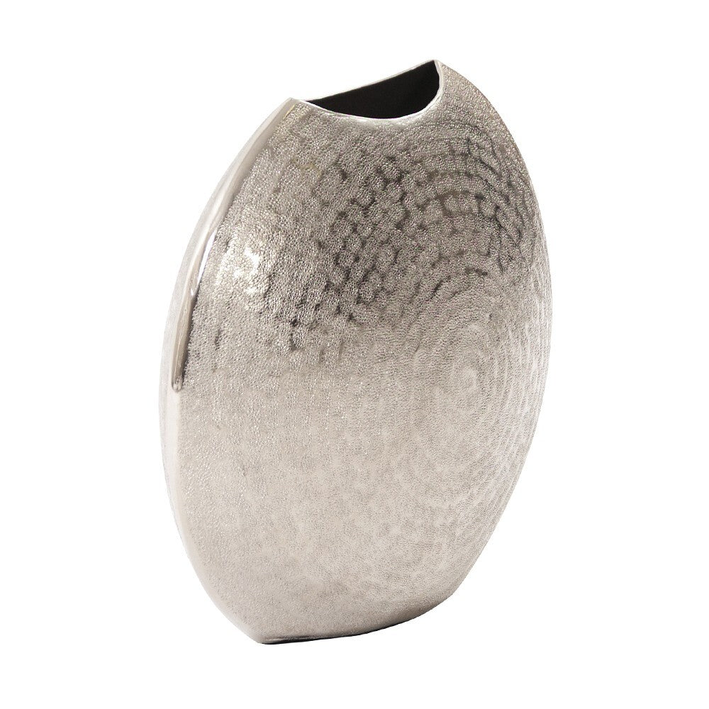 Modern disc shape vase hammered silver side view displaying contemporary sculptural aesthetic