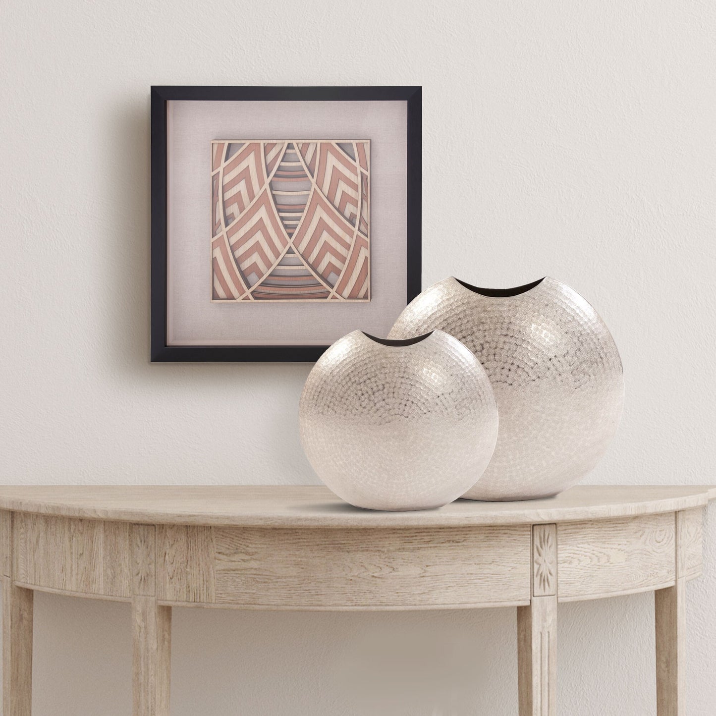 Silver disc decorative vase full view demonstrating unique 10 inch sculptural design