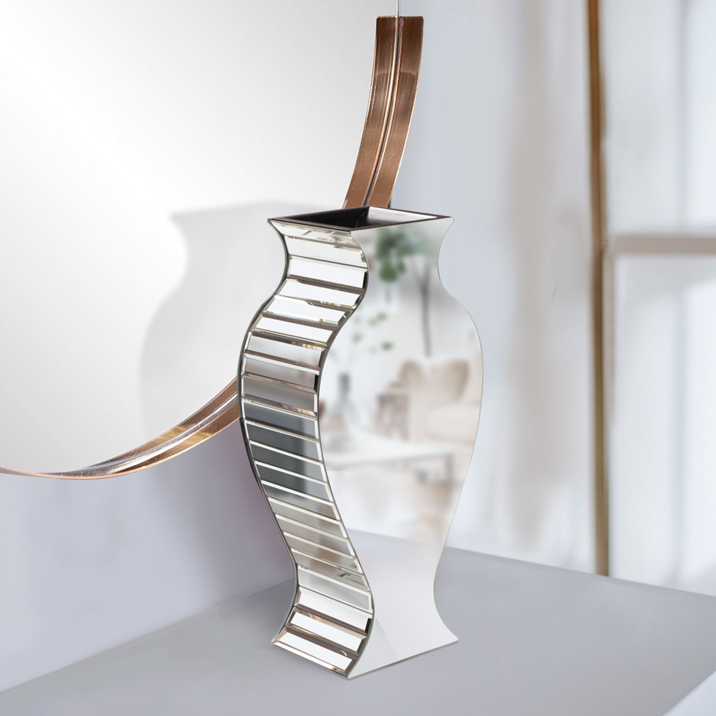 Beveled mirror vase detail showcasing light reflections and geometric panel design, perfect for upscale event decorations