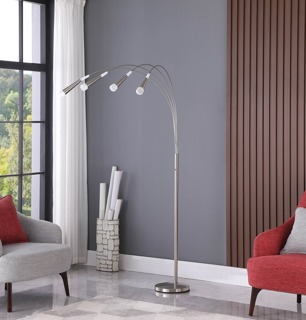 Detail of weighted base and nickel stem on modern arc floor lamp ensuring stability and safety in living spaces