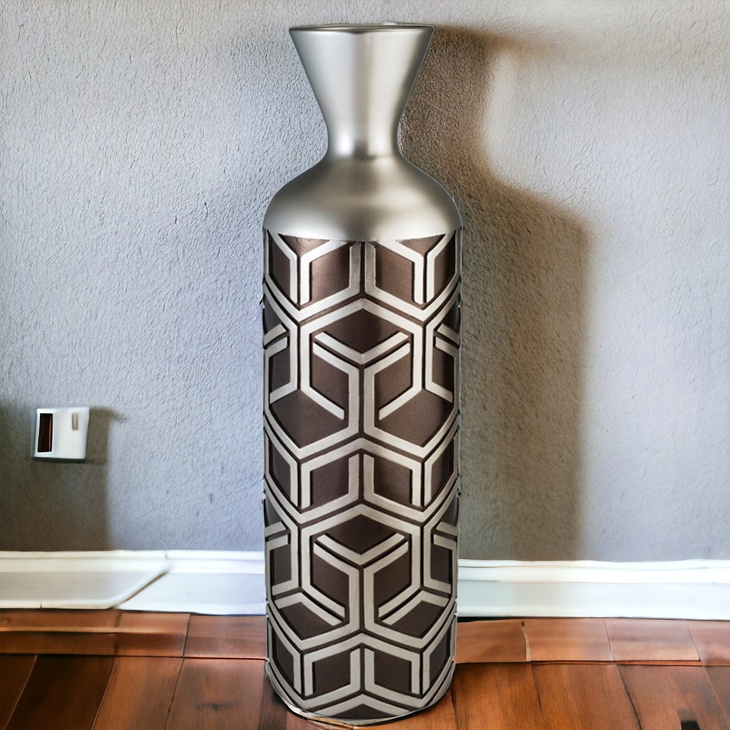 Close-up of brown and metallic silver geometric pattern on premium polyresin floor vase