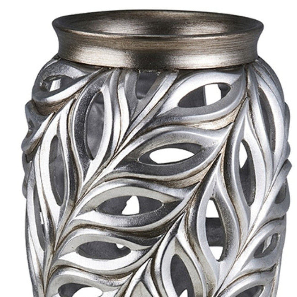 Detail of silver leaf pattern on gray urn vase, elegant metallic accents create refined look for classic home styling