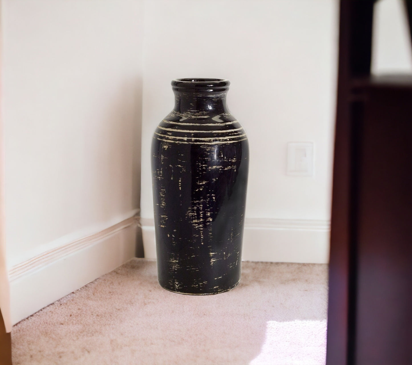 Side angle of 18-inch striped ceramic vase displaying sophisticated black and ivory design with classic proportions, perfect for tall floral arrangements