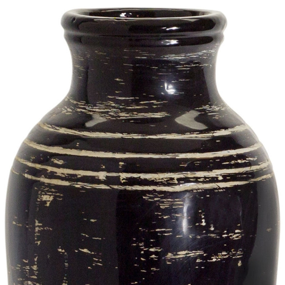 Three-quarter view of traditional urn-shaped floor vase emphasizing elegant curves and striking striped pattern, versatile decorative accent for any room