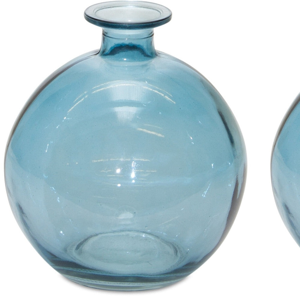 Set of 2 translucent blue glass vases showing light-catching color, perfect for beach house decor