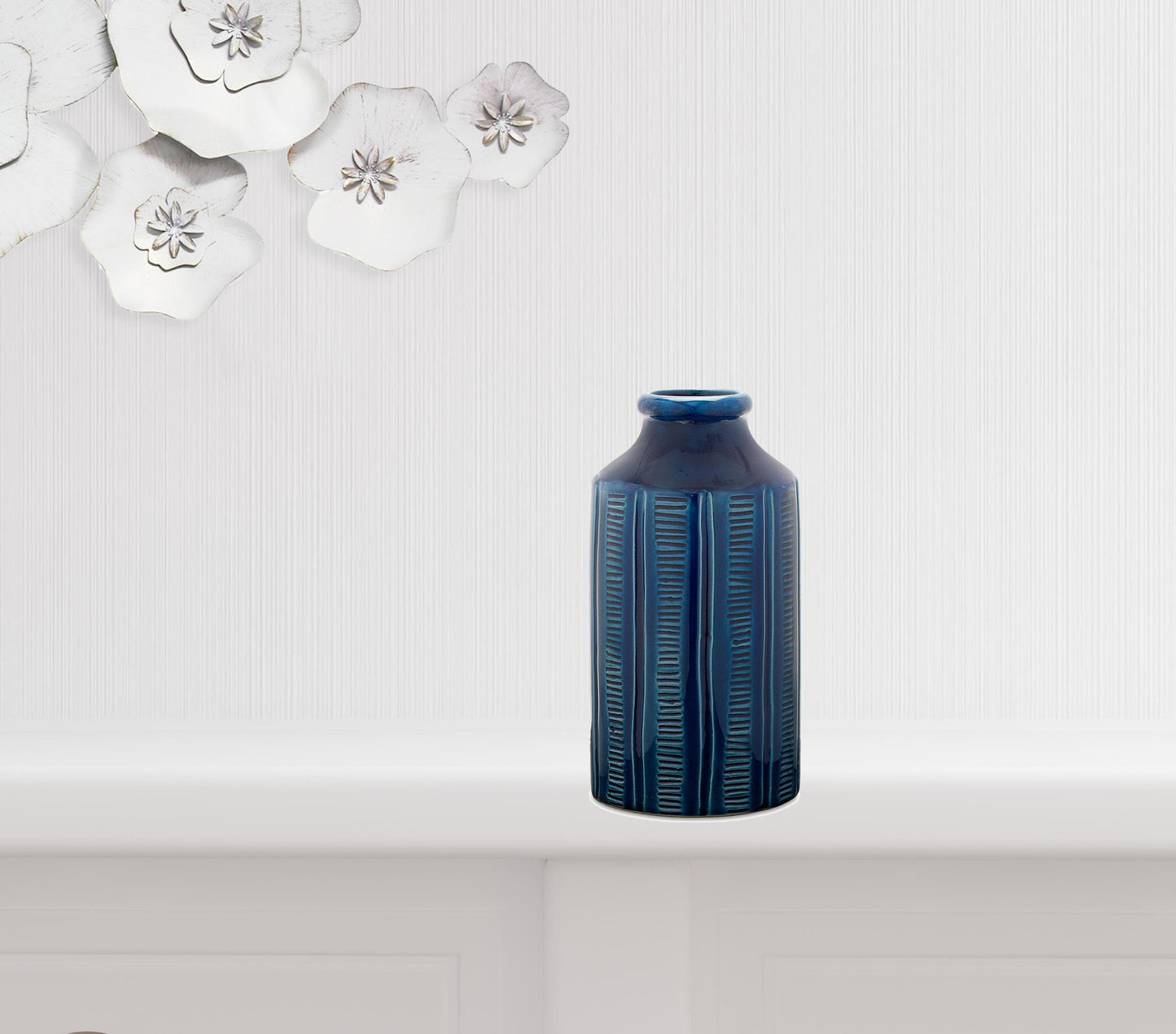 Close-up of vibrant blue color and ribbed texture on contemporary terracotta round vase