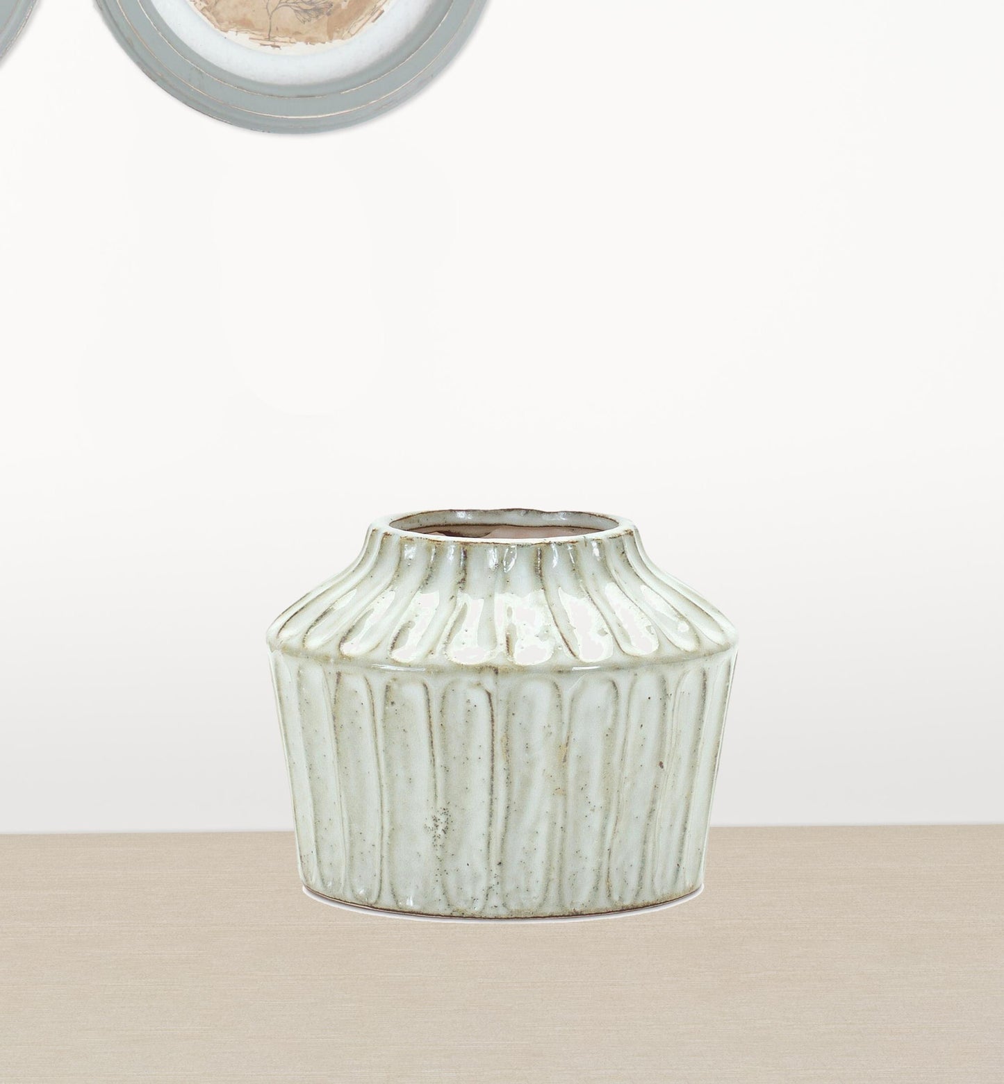 Ribbed ivory ceramic vase detail view showing textured pattern, 6 inch contemporary centerpiece