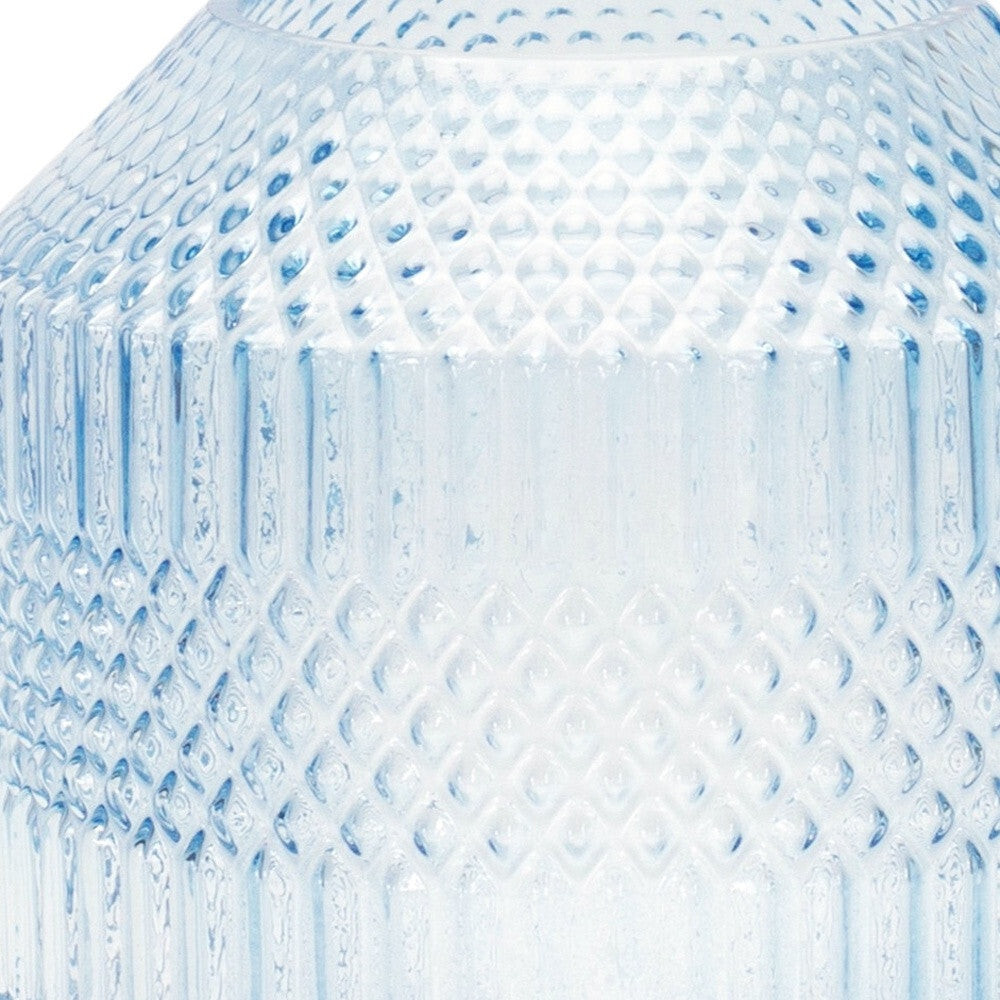 Geometric pale blue cylinder vase on display, versatile accent for desks and small tables