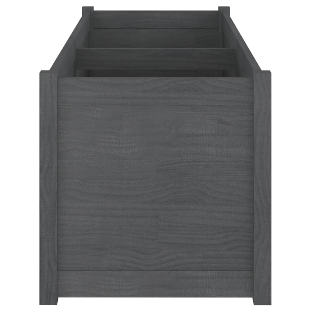 Large grey pine wood garden planter with plants in outdoor setting - modern raised bed