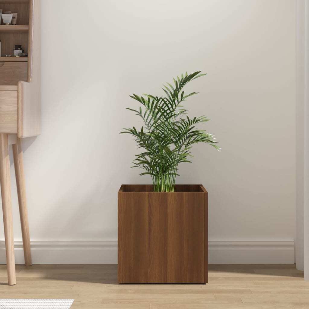 Brown oak planter box with green plant in modern living room setting - square engineered wood indoor planter