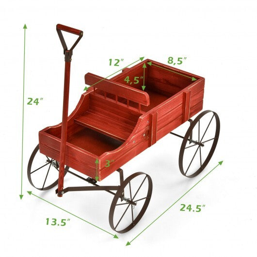 Empty red wooden wagon planter showing side view with wheels and handle