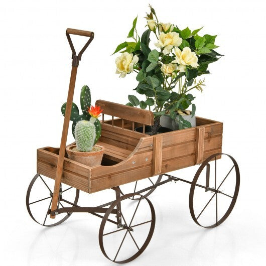Brown wooden wagon planter with wheels filled with mixed garden plants