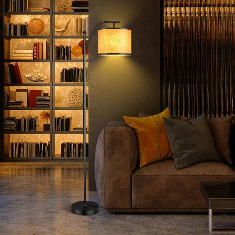 Close-up of beige fabric drum lampshade on modern floor lamp showing soft light diffusion and elegant neutral design perfect for any room