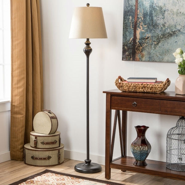 Matching black table lamps with light gold drum shades from 3-piece lighting set, perfect for bedroom nightstands or living room accent tables