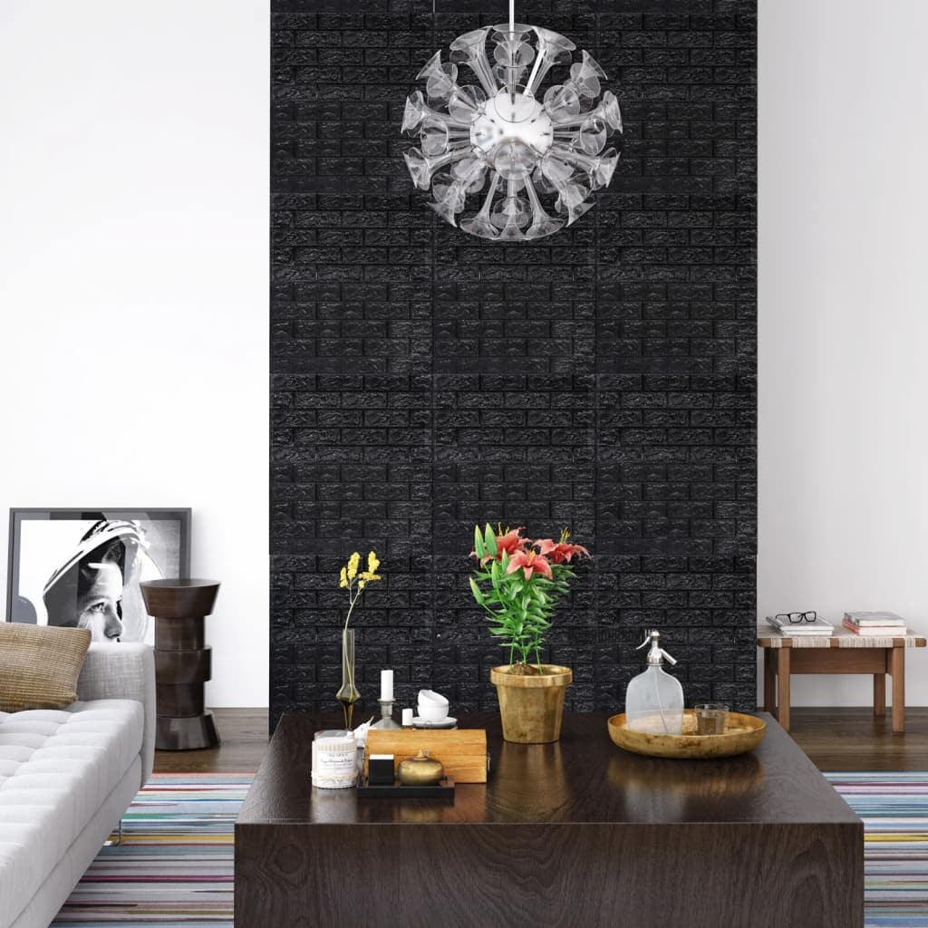 Living room with a black textured wall, decorative plants, and a chandelier.