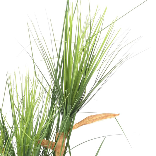 Close-up of lifelike artificial grass plant showing natural green blades with brown accents in stylish cylindrical pot, maintenance-free decorative accent perfect for modern contemporary interiors
