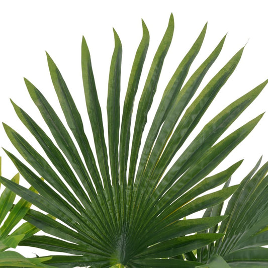 Close-up of lifelike artificial palm plant showing vibrant green fronds and earthy brown pot with wooden base, zero maintenance tropical decorative accent
