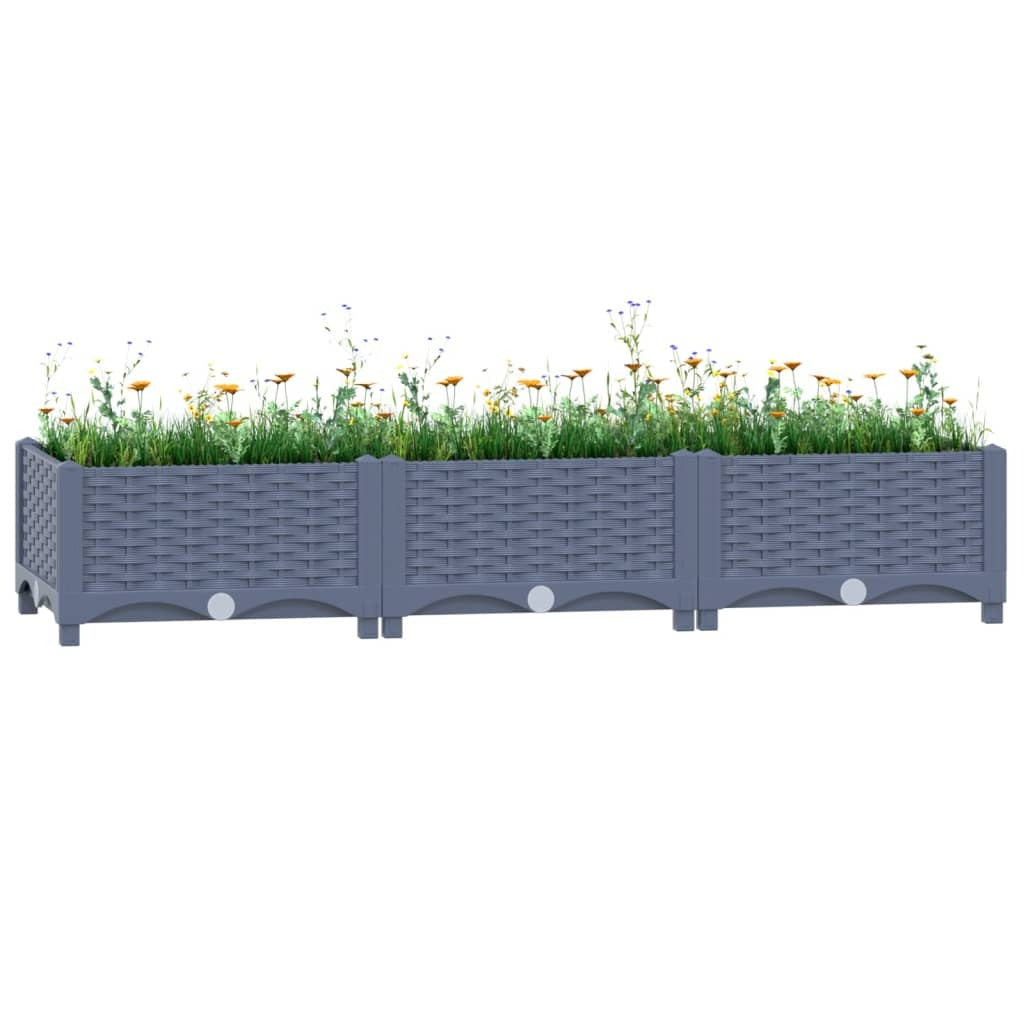Durable blue-grey raised garden bed filled with plants showing UV-resistant polypropylene construction
