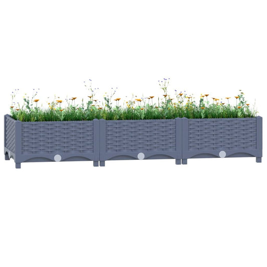 Durable blue-grey raised garden bed filled with plants showing UV-resistant polypropylene construction
