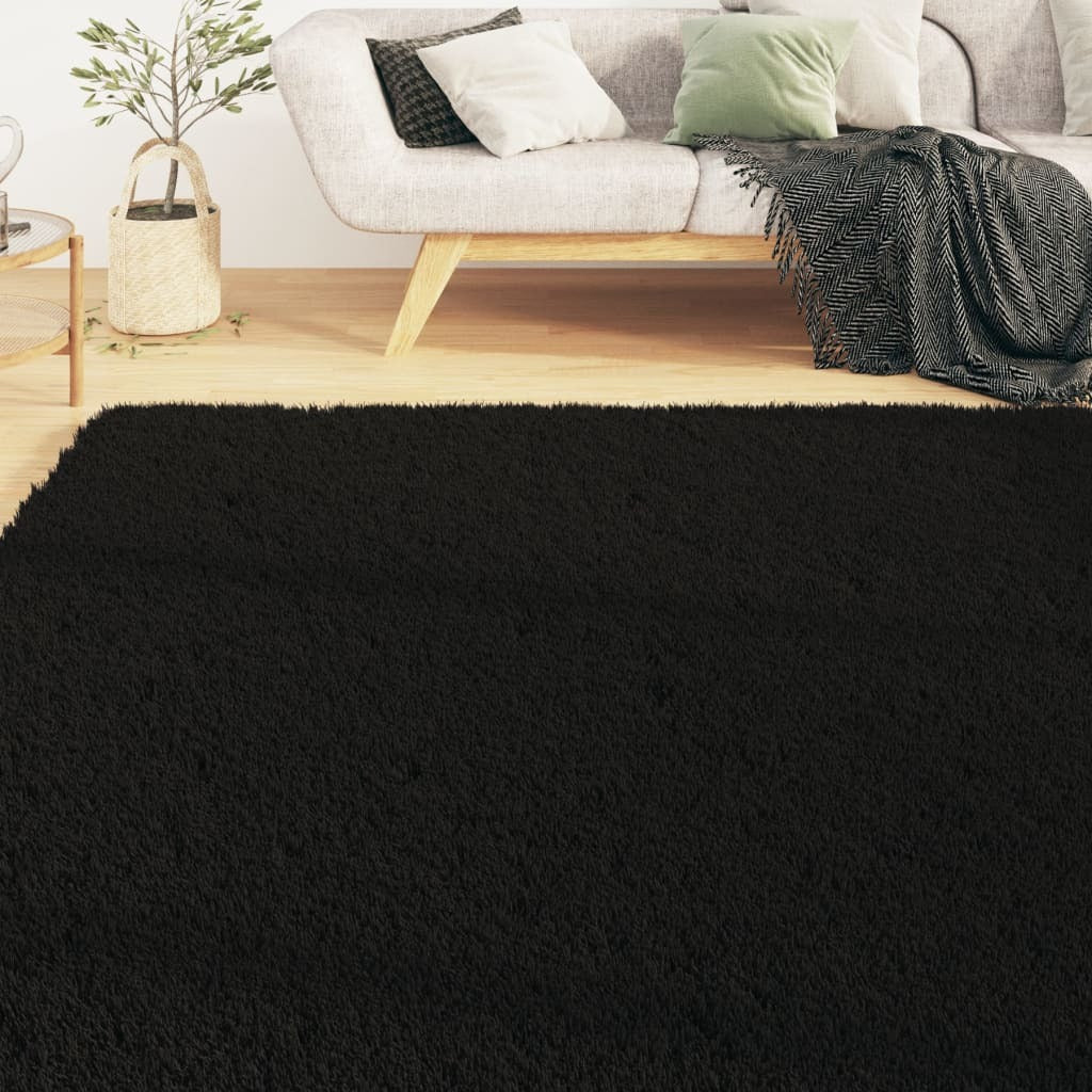 Black rectangular rug corner detail showing non-slip backing and secure grip technology
