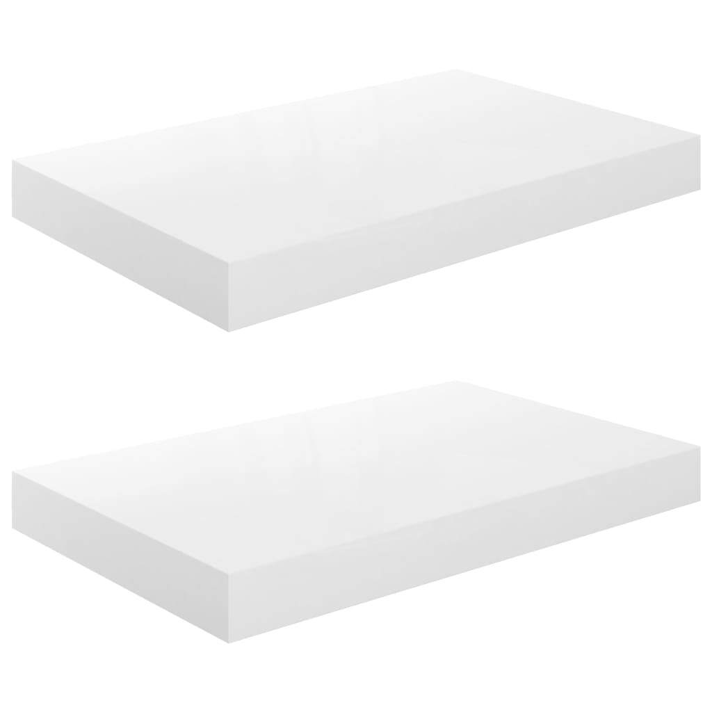 White floating wall shelves in modern bedroom interior with decorative items
