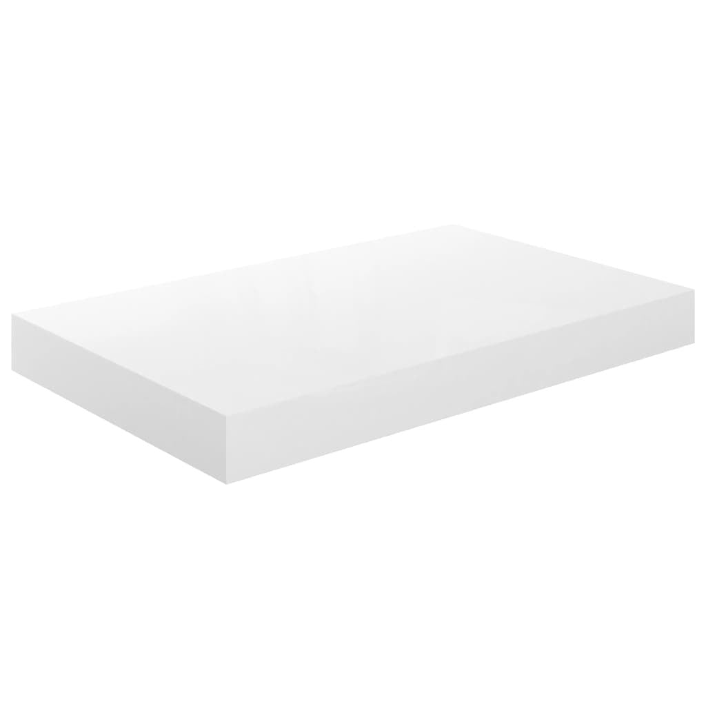 High gloss white floating shelves displaying books plants and modern accessories
