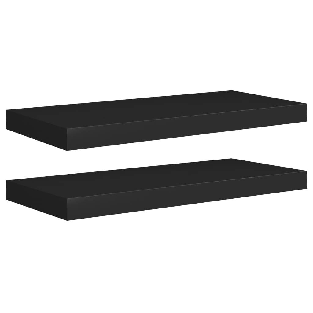 Black floating wall shelves in modern bedroom interior with decorative items
