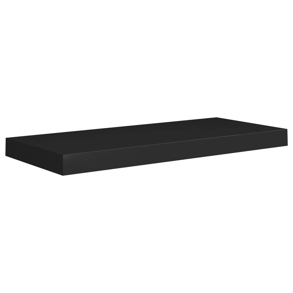 Close-up of single black floating wall shelf showing clean minimalist design
