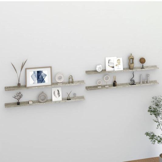 Set of 4 concrete gray wall shelves installed in modern living room displaying books and decorative items
