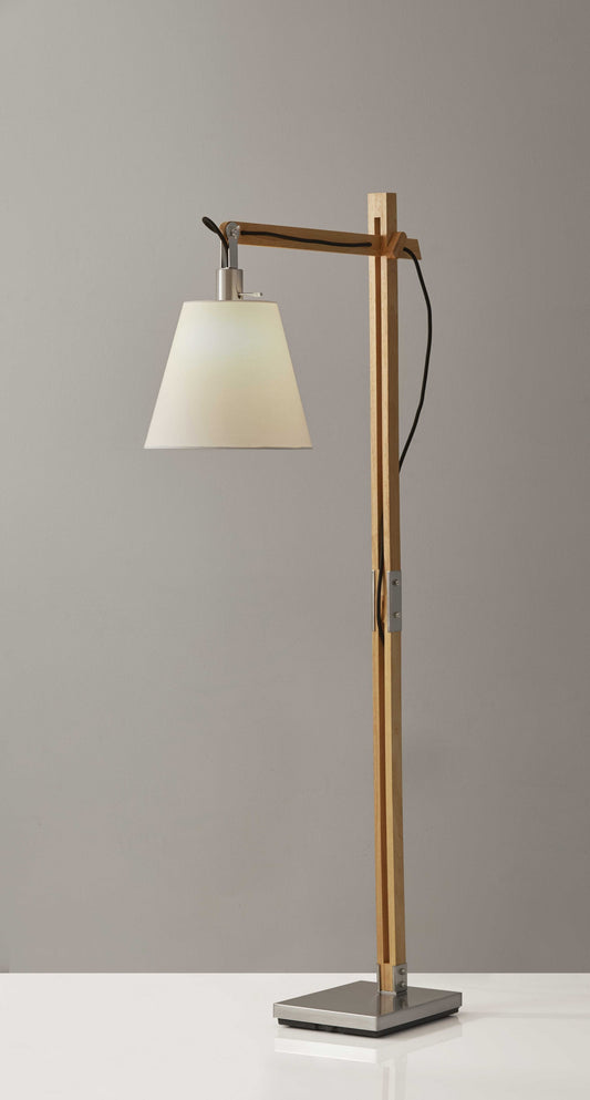 Natural wood floor lamp with adjustable hinged arm featuring Scandinavian design, perfect for reading and task lighting in modern living spaces