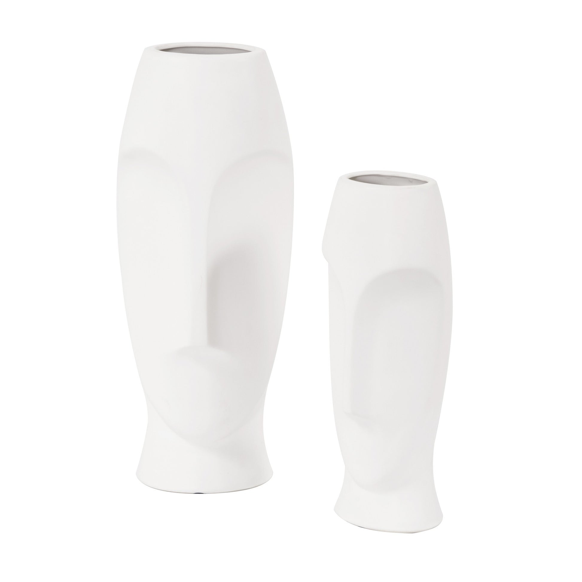Side view of white ceramic cylinder vases showing sleek shape and artistic face detail
