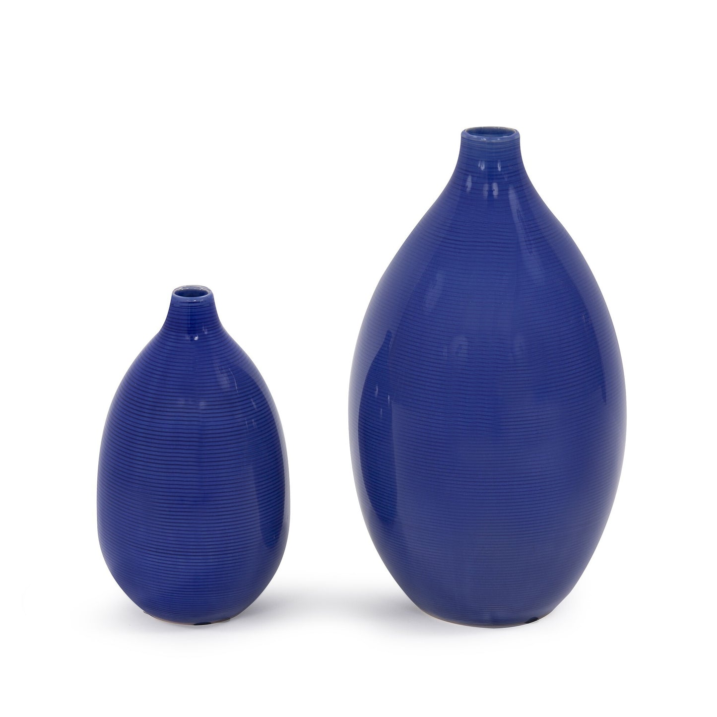 Indigo blue bulb vases showing padded feet for surface protection and versatile display options
