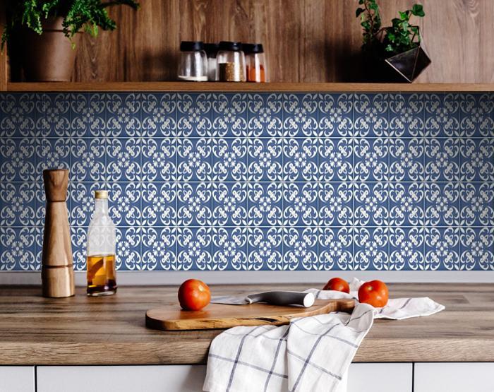 Close-up view of wedgwood blue and white vinyl tiles showing detailed ornate pattern and classic colors
