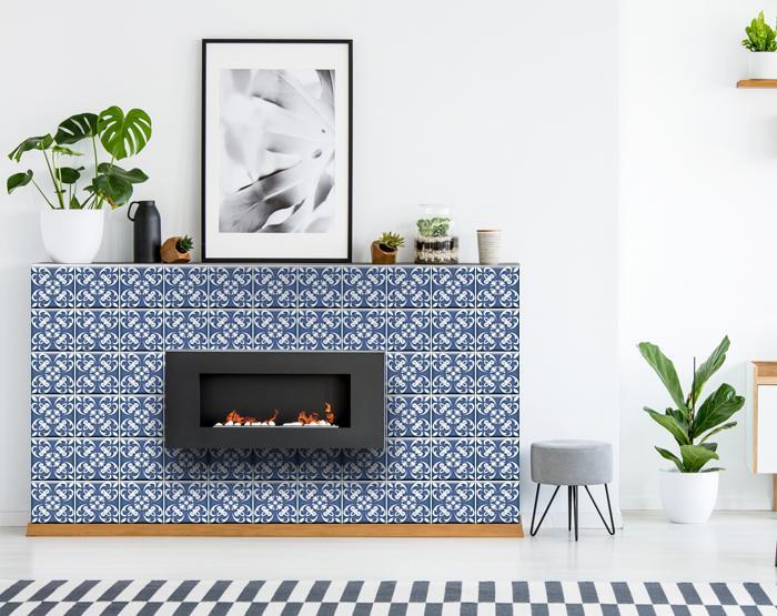 Bathroom accent wall featuring wedgwood blue and white peel and stick tiles as decorative element
