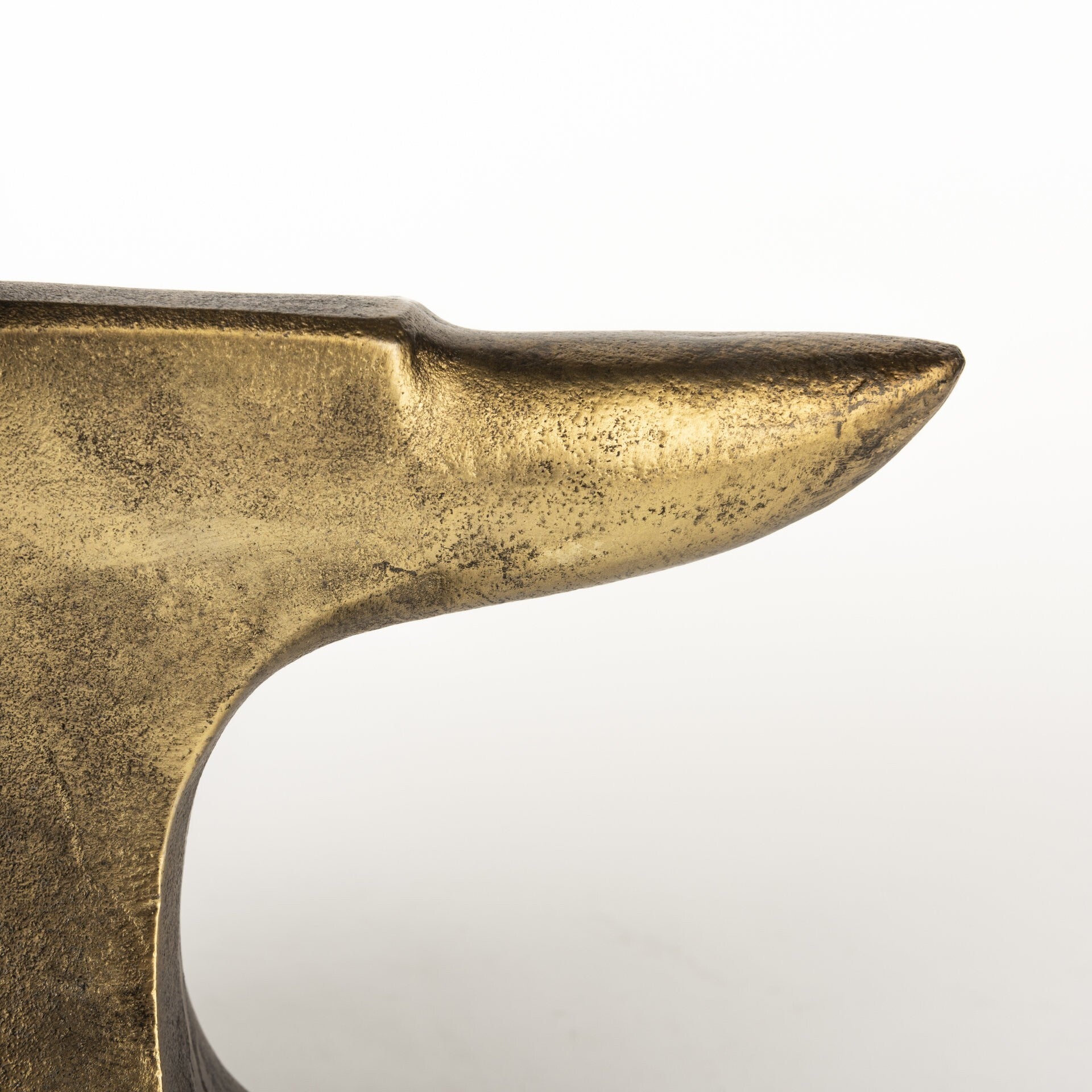 Pair of distressed gold anvil bookends displaying substantial weight and non-slip design for stable book storage
