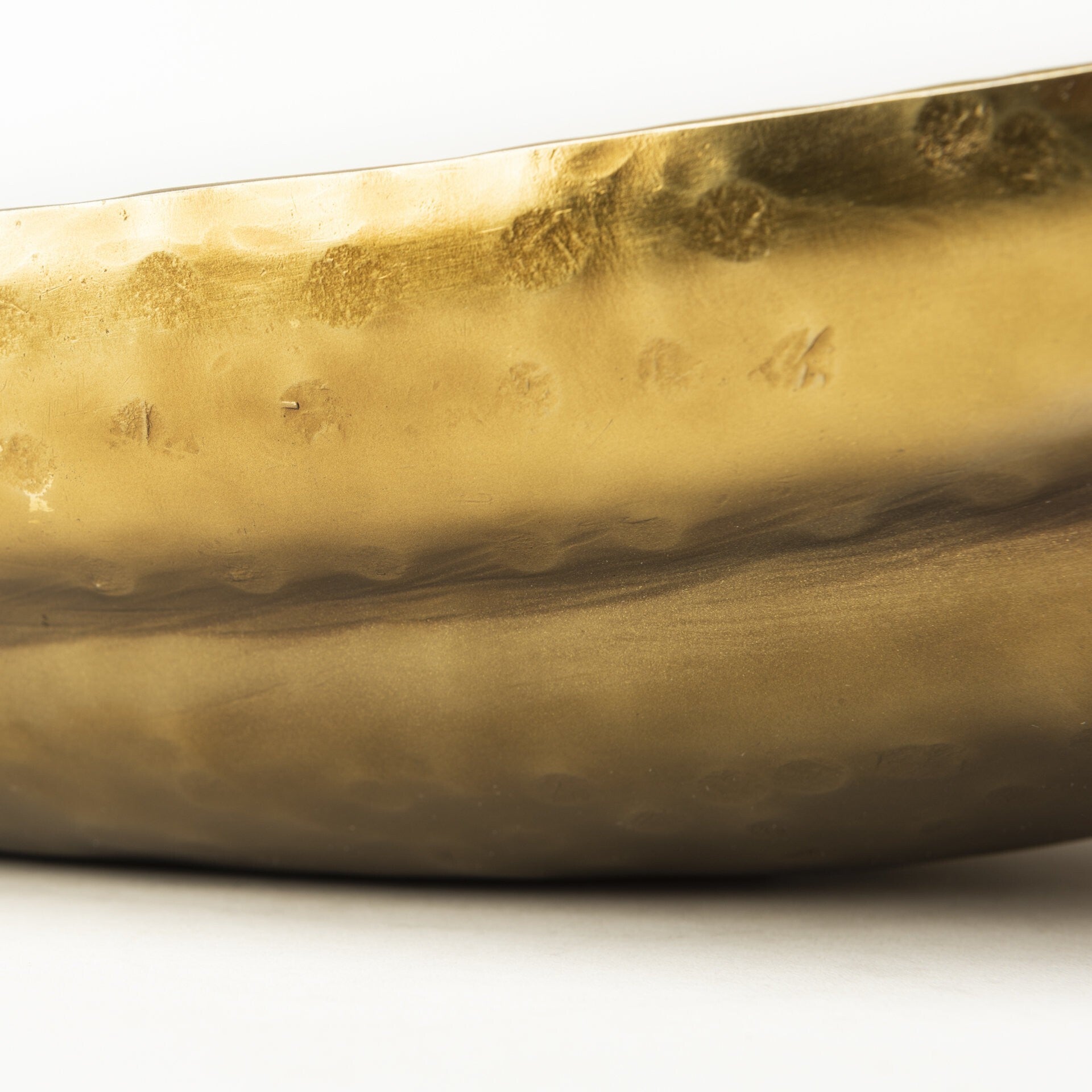 Large boat shaped decorative bowls in distressed gold finish ideal for rustic modern interiors
