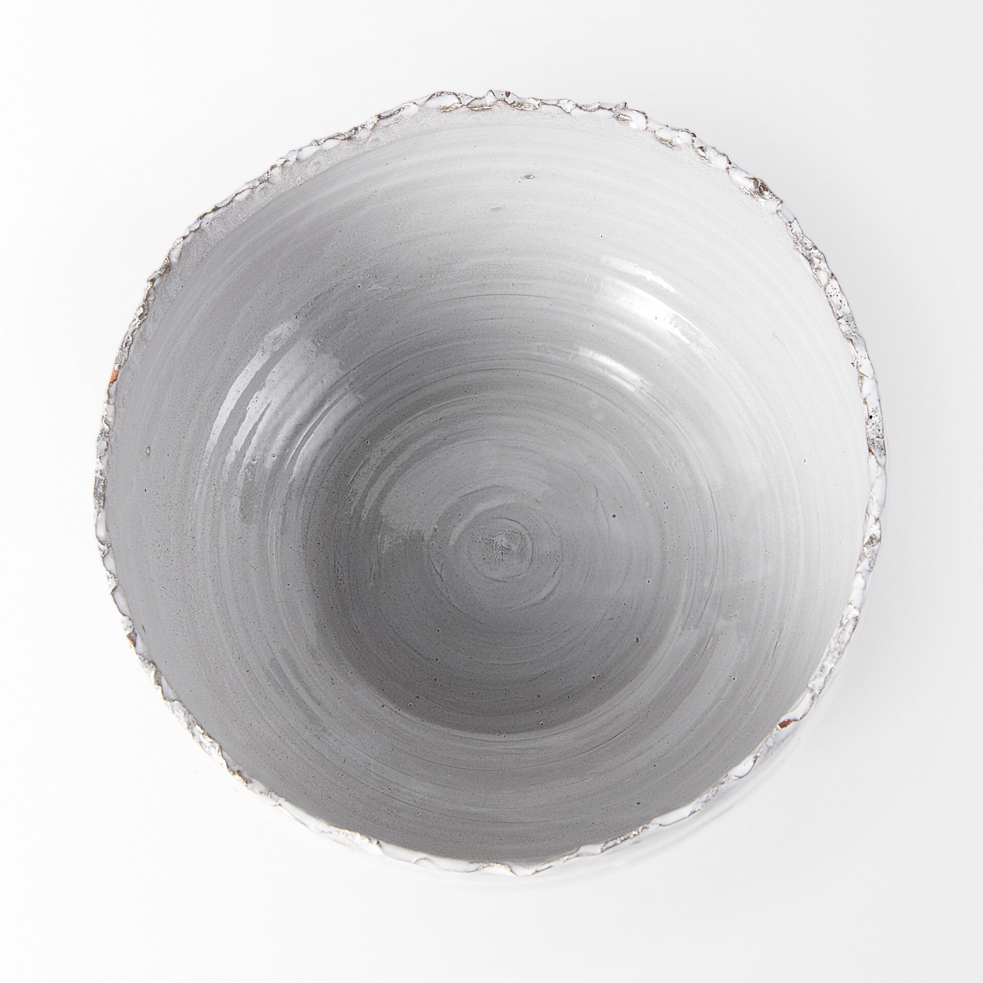 Artisan ceramic centerpiece bowl top view showing scalloped rim design and two-tone glaze pattern
