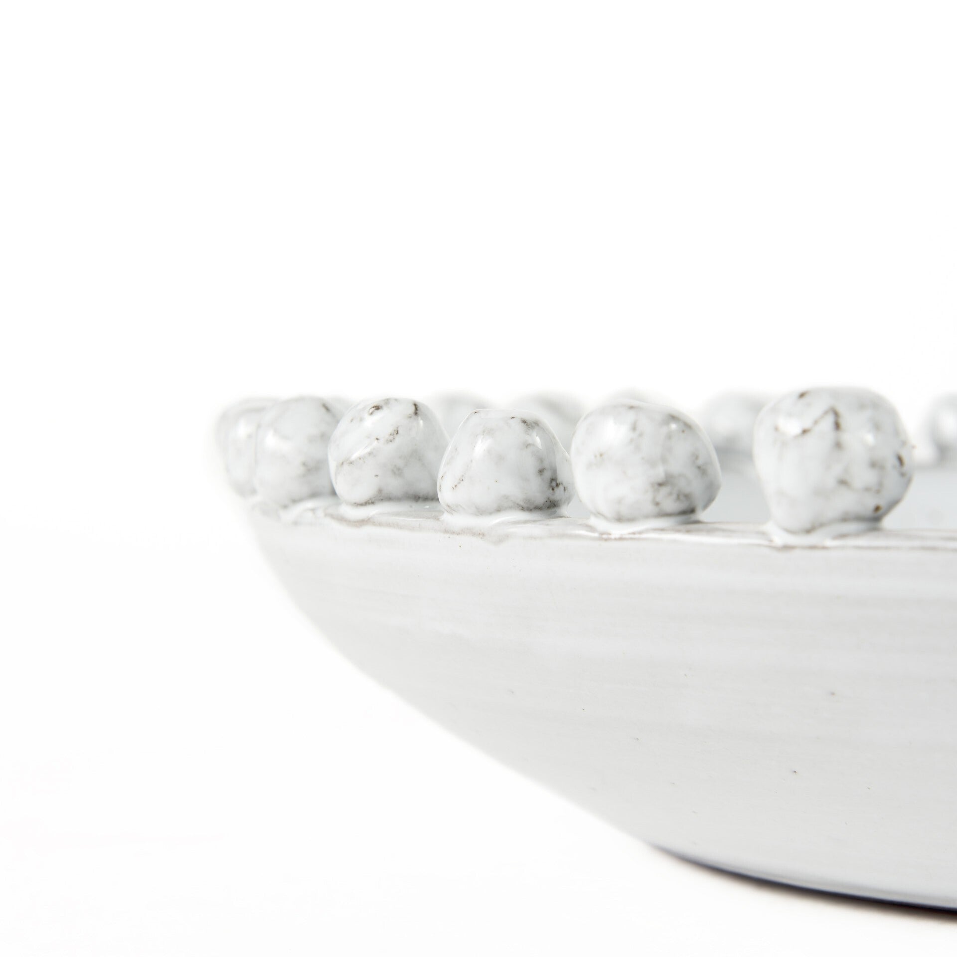 Off white ceramic centerpiece bowl detail shot highlighting smooth ceramic finish and quality craftsmanship
