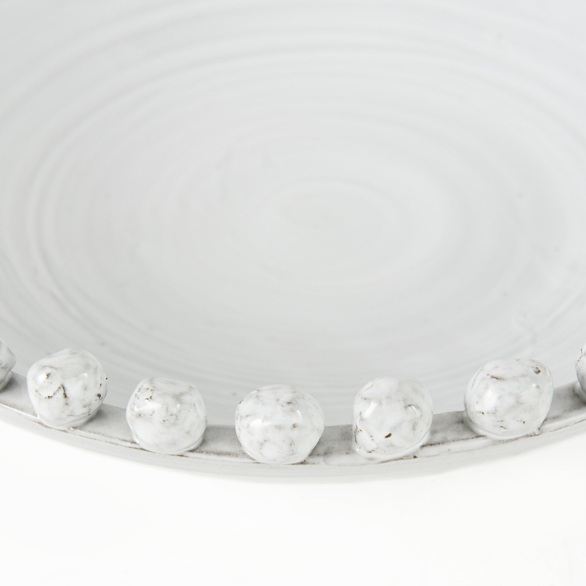 Off white ceramic decorative bowl close-up view showing premium material and modern aesthetic
