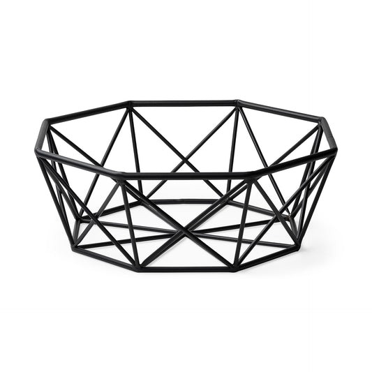 Black geometric metal centerpiece bowl with architectural cutout pattern, modern minimalist table decor
