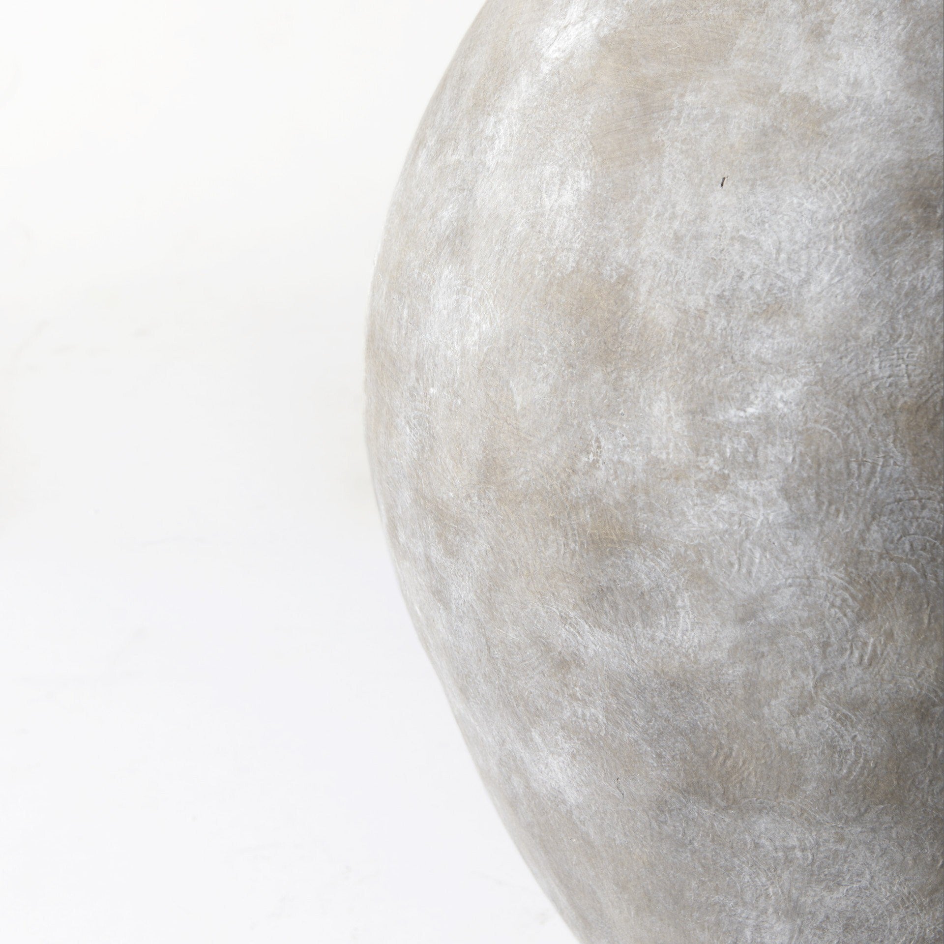 Natural wash ceramic Kyros vase on display, dramatic statement piece for modern interiors
