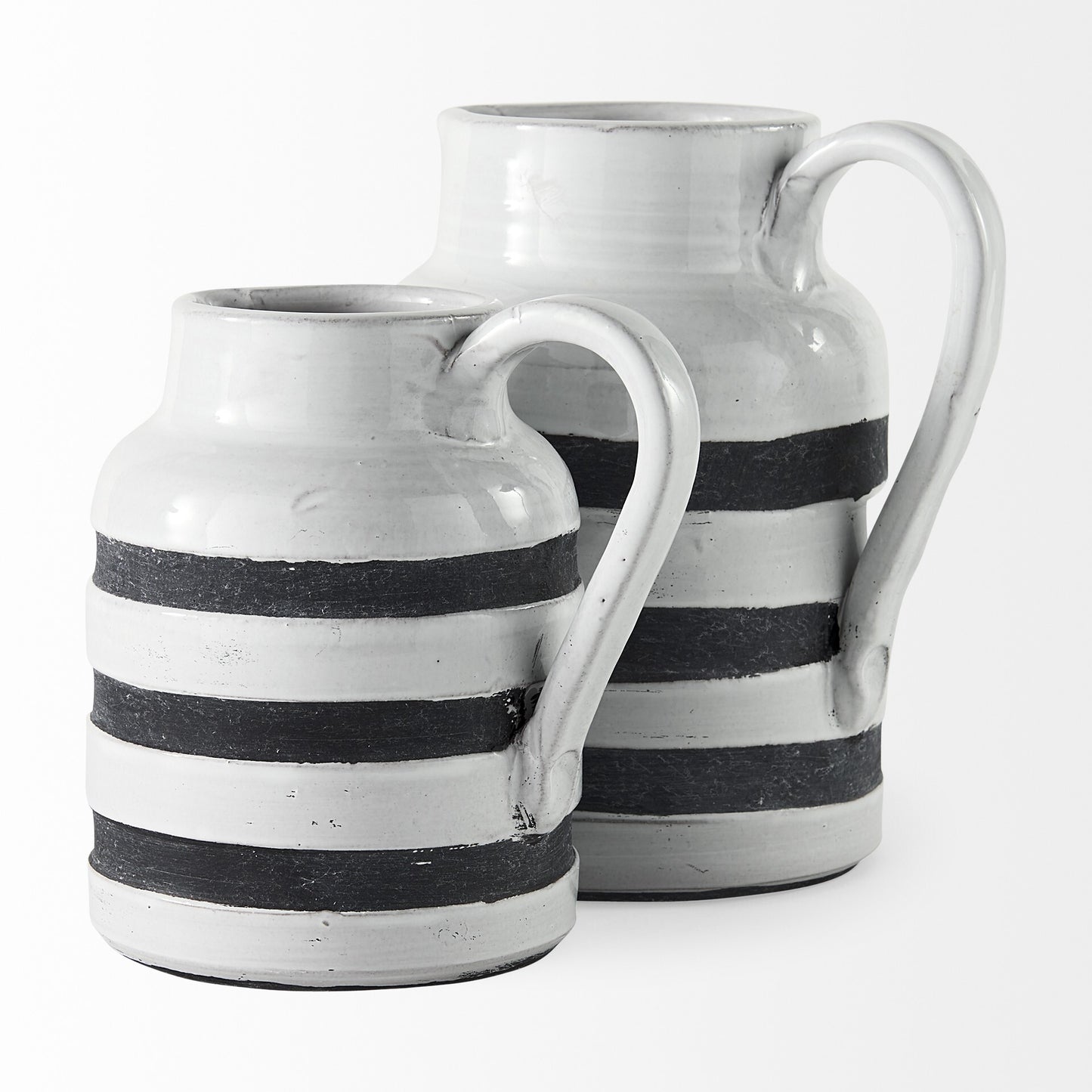 Rustic white blue stripe ceramic pitcher displaying artisan charm and functional handle design
