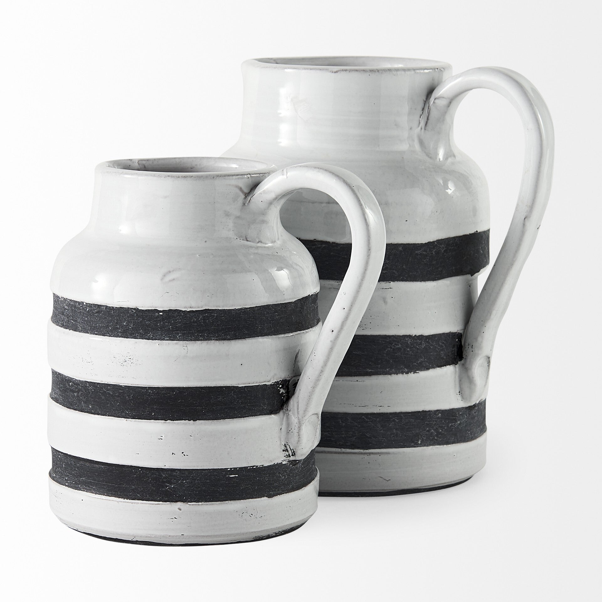 Rustic white blue stripe ceramic pitcher displaying artisan charm and functional handle design
