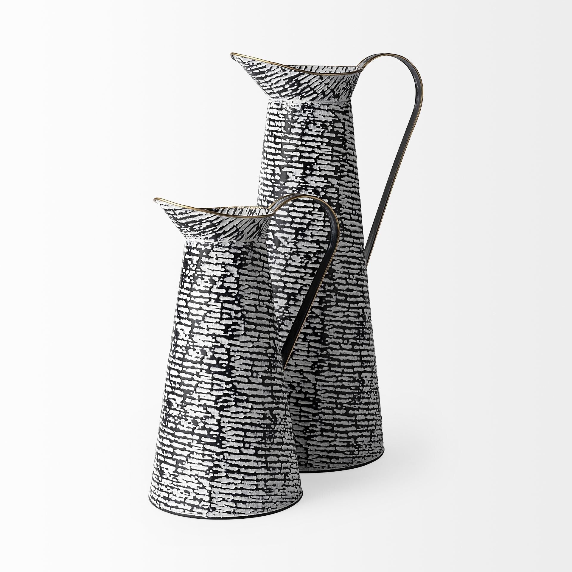 Contemporary metal jug vase close-up displaying unique textured pattern finish in black and white

